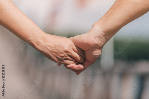 couple holding hands.selective focus.
