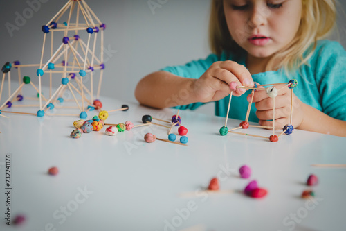 little girl making geometric shapes, engineering and STEM