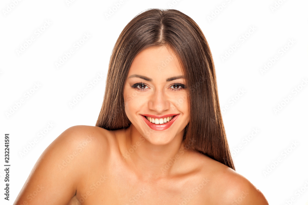 Portrait of young beautiful smiling woman with makeup on white background Portrait of young beautiful smiling woman with makeup on white background
