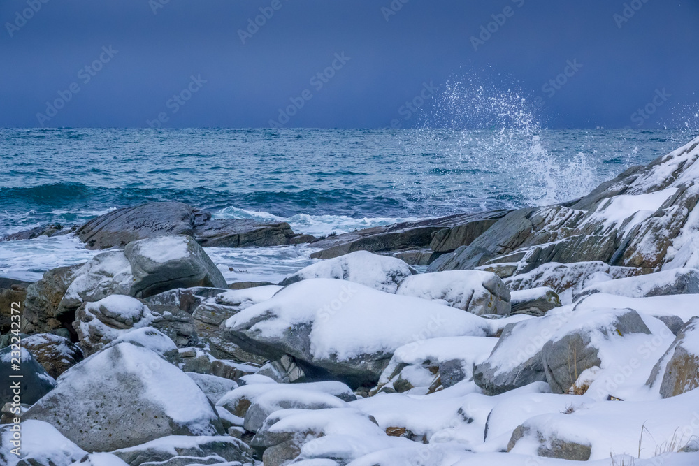 Snow-Covered Stones on the Ocean Coastline Snow-Covered Stones on the Ocean Coastline