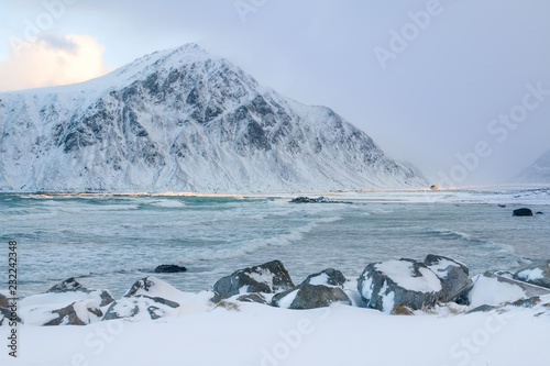 Ray of Sun on a Winter Beach in Norway © goodman_ekim
