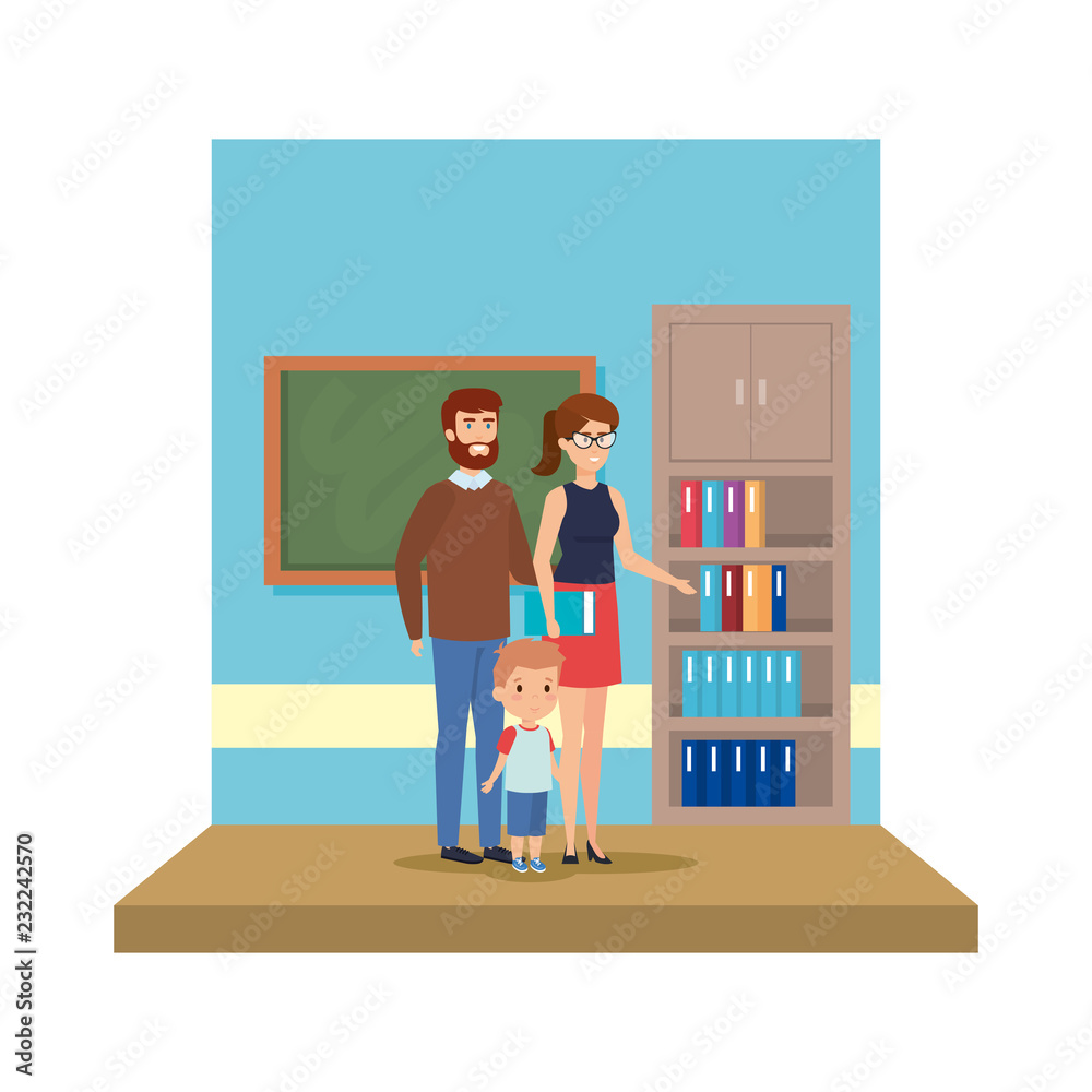 couple teachers with boy in the classroom