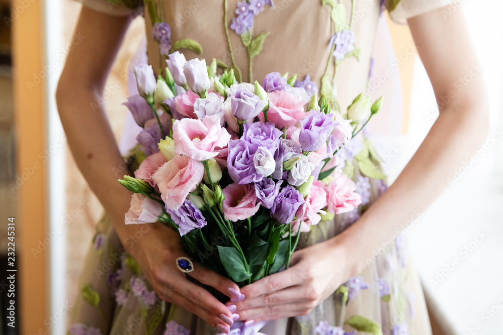 Wedding bouquet of flowers in the hands of the bride Wedding bouquet of flowers in the hands of the bride
