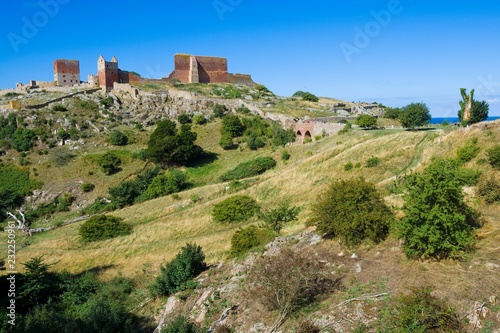 Hammershus castle - the biggest Northern Europe castle ruins situated at steep granite cliff on the Baltic Sea coast, Bornholm, Denmark