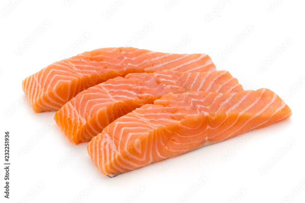 Fresh salmon fillet with basil on the white background.