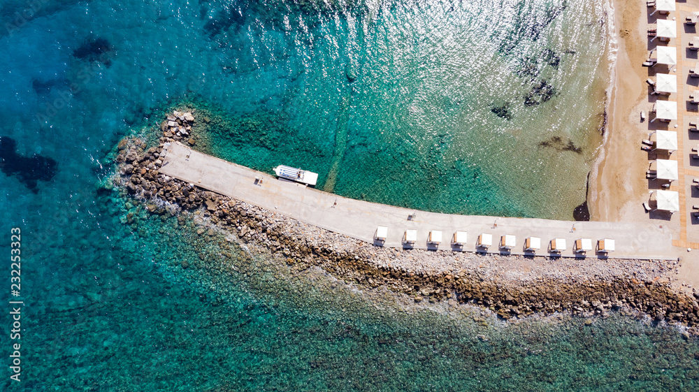  Aerial view of the pier with rocks and cliffs to the sea. panoramic view from above. Summer sea and tourism on the coast of Greece. Mediterranean Sea