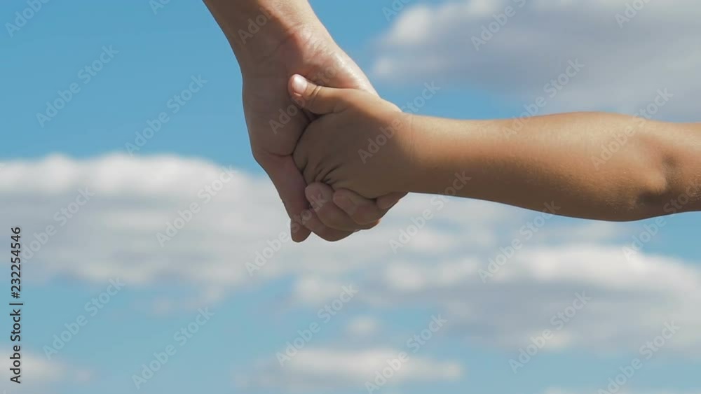 Mother holds the hand of a child. Mother holds the hand of a child.