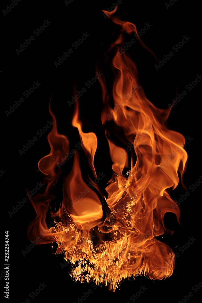 magical fire ignition - burning red-orange hot flame - fiery elements isolated on a black background magical fire ignition - burning red-orange hot flame - fiery elements isolated on a black background