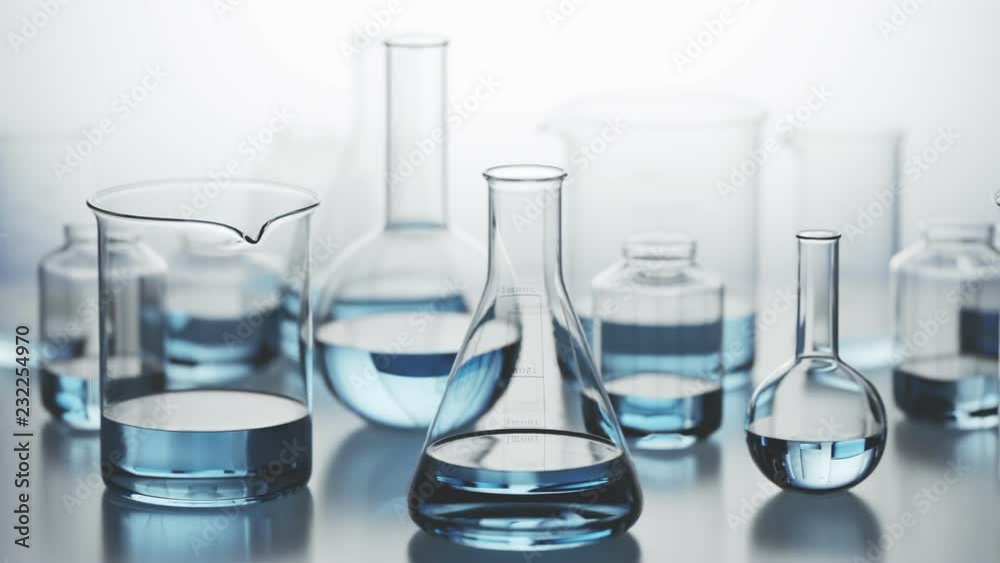 Laboratory glassware with blue liquid inside on a light background. Looping 4KHD Laboratory glassware with blue liquid inside on a light background. Looping 4KHD