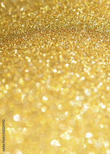 Golden glitter sparkling background. Shiny glam abstract texture. 