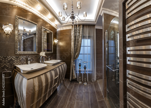 Bathroom in brown tones with two sinks