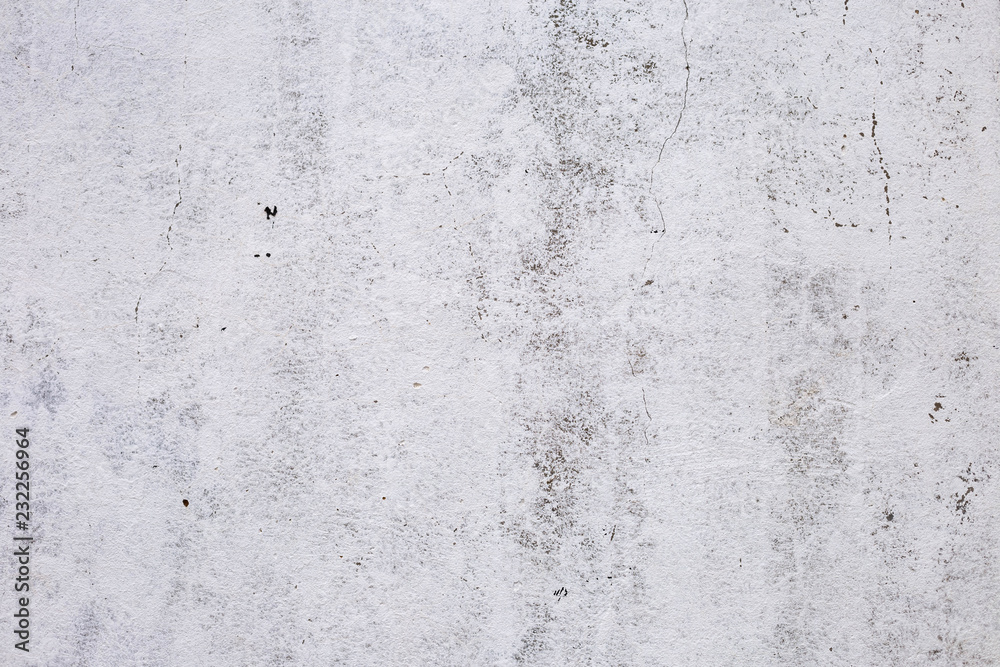 brick plastered wall with whitewash with potholes, cracks and stains, shot on a cloudy autumn day brick plastered wall with whitewash with potholes, cracks and stains, shot on a cloudy autumn day