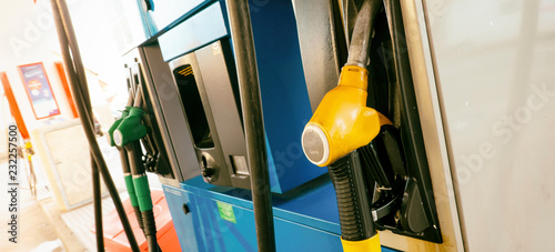 Pump nozzles for filling several gas at petrol station. Close up