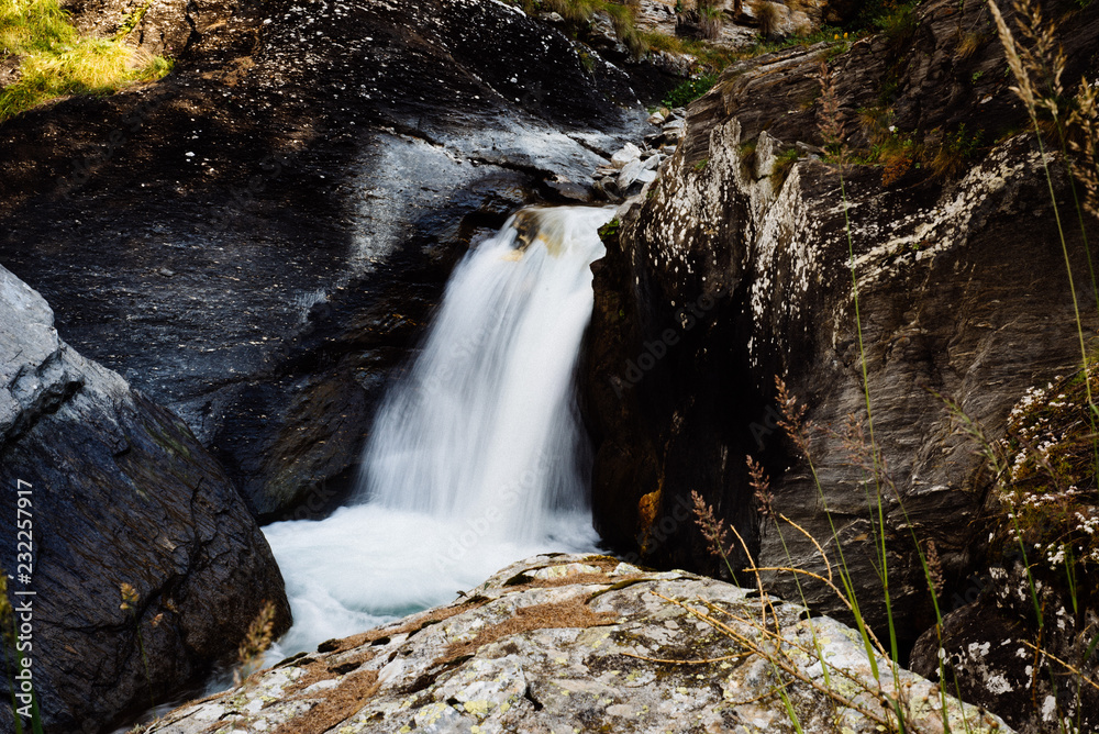 Obraz premium river waterfall in the mountains slow flowing water photographic effect slow