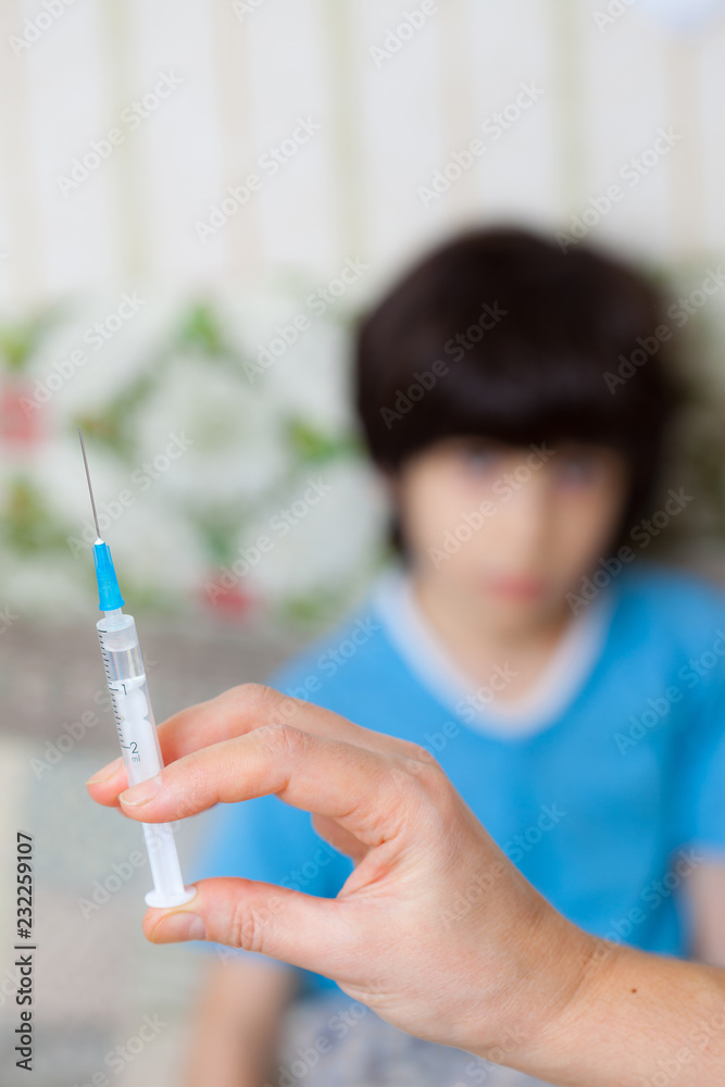 Doctor hand with syringe and child Doctor hand with syringe and child