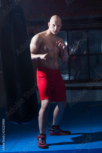 fighter in red shorts