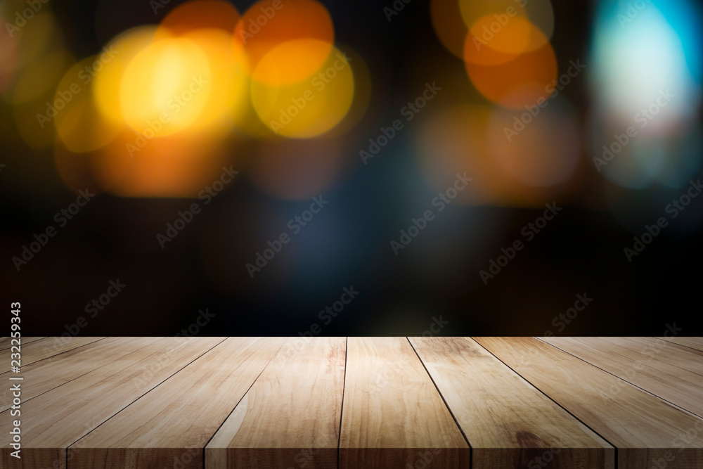 Empty wooden table platform and bokeh at night.