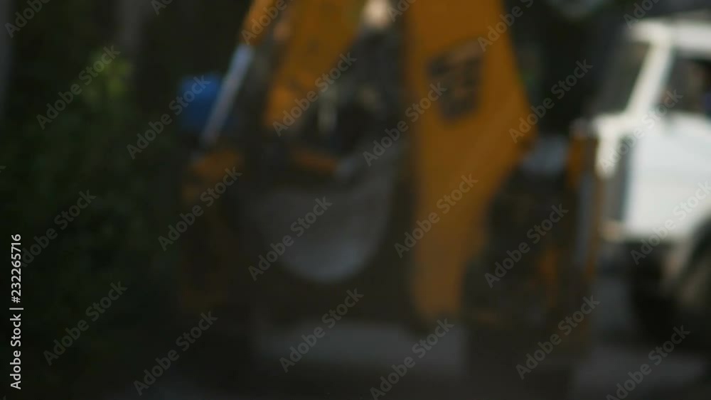 tractor drives away from the camera to defocus tractor drives away from the camera to defocus