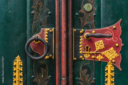 Ornate doorhandle and knocker of St. Georg church in Ulm, Germany