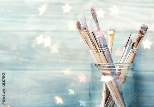 Row of artist paint brushes  on background