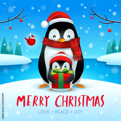 Adult penguin and baby penguin in Christmas snow scene.