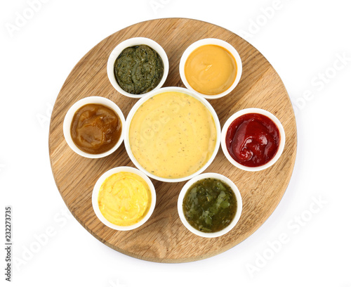 Wallpaper Mural Wooden board with tasty sauces in bowls on white background Torontodigital.ca