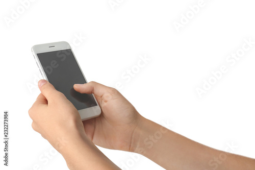 Young woman holding mobile phone on white background