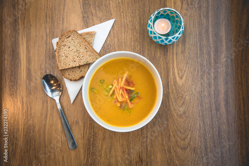 Aerial view above a bowl of healthy pumkin soup