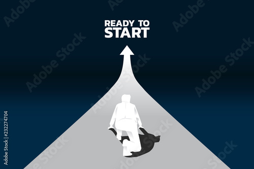Silhouette of businessman ready to run from start line on growing graph. Concept of people ready to start career and business