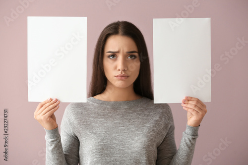Emotional young woman with ...
