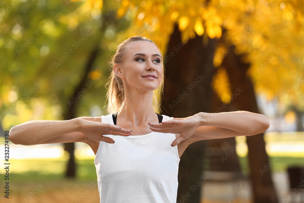 Sporty young woman training in autumn park Sporty young woman training in autumn park