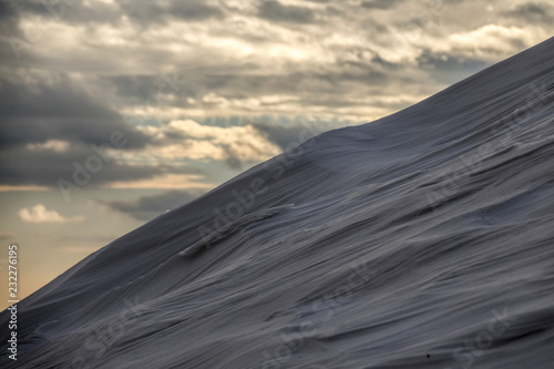 drifts from snow after a snowfall. Snow dunes.