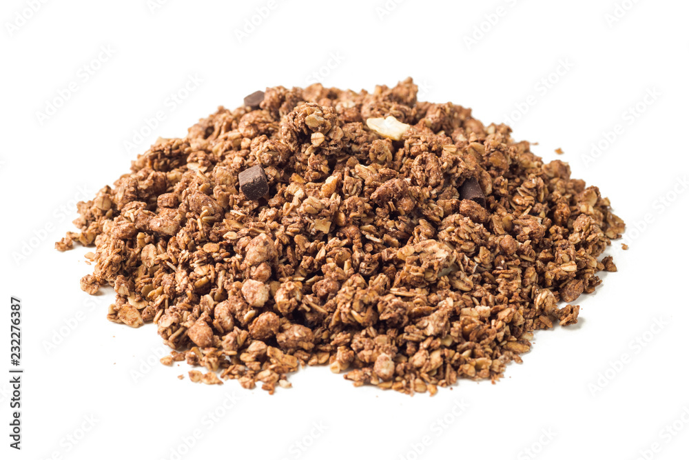 Crunchy granola, muesli pile with chocolate isolated on white background