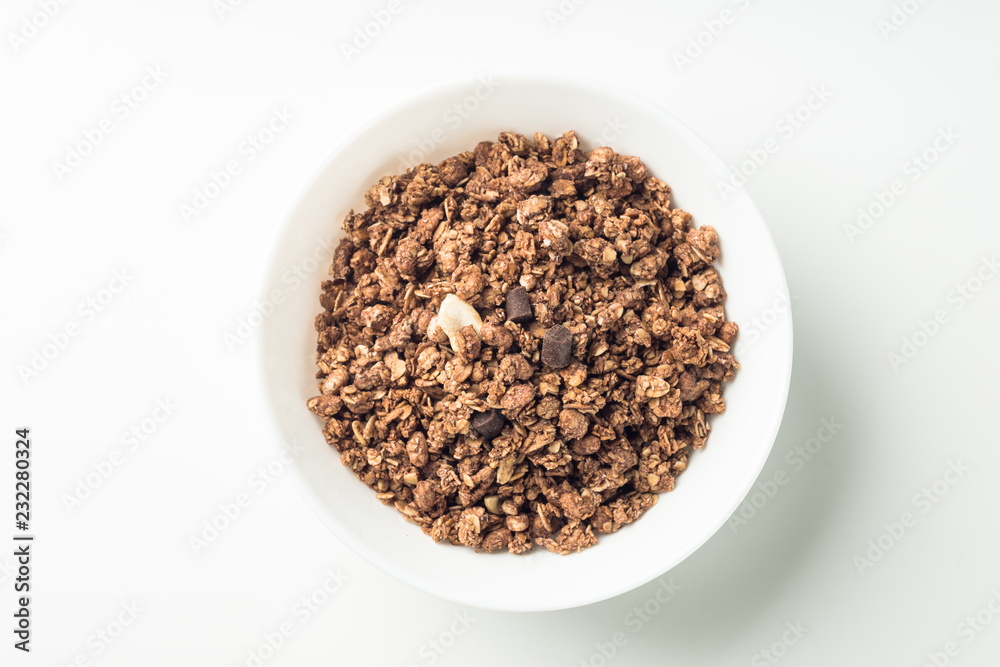 Granola breakfast on a bowl over white background Granola breakfast on a bowl over white background