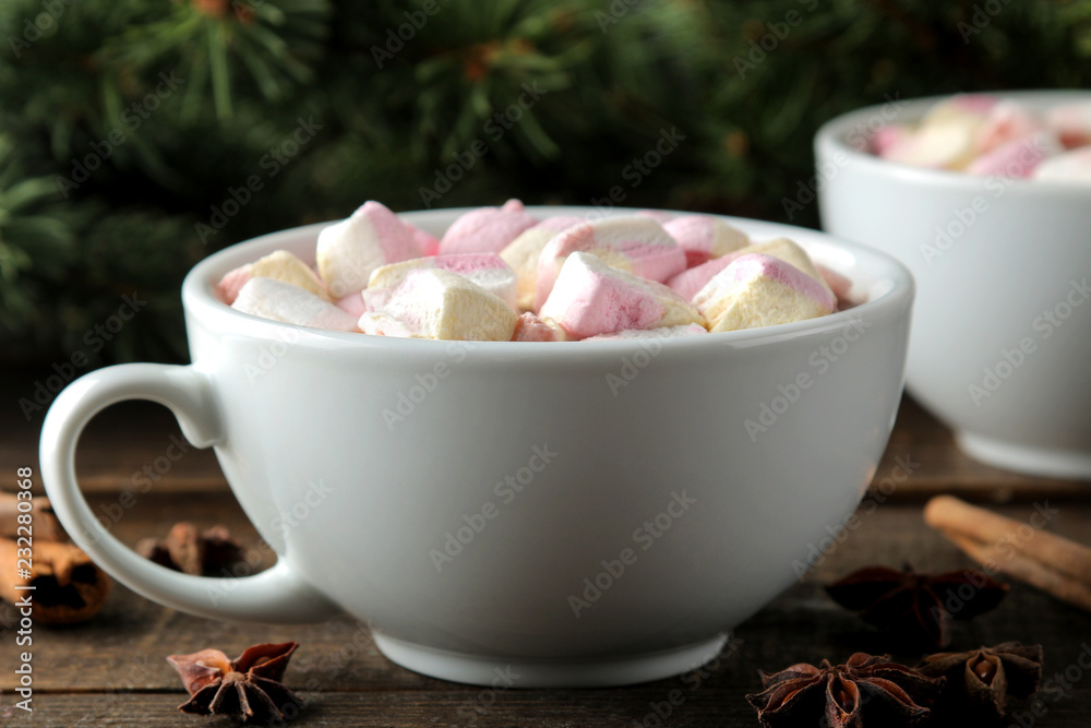 hot cocoa with marshmallows in a cup on a brown wooden background. Winter. new Year. Christmas hot cocoa with marshmallows in a cup on a brown wooden background. Winter. new Year. Christmas