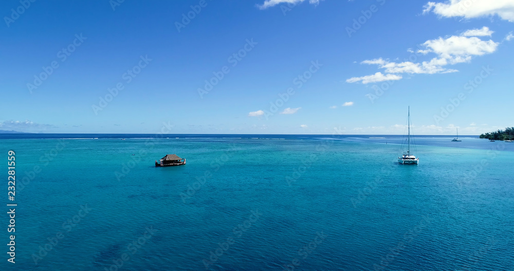 boat bungalow (house) on a lagoon in aerial view, French Polynesia boat bungalow (house) on a lagoon in aerial view, French Polynesia