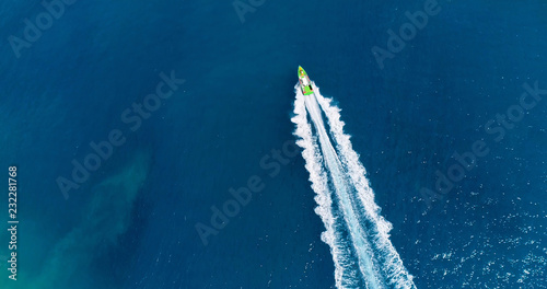 boat in a lagoon in French Polynesia, in aerial view
