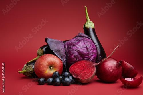 Photography close-up view of ripe organic apple, grapes, onions, beetroot, cabbage and eggpl