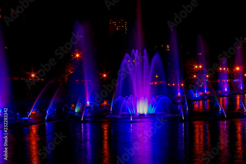 Fototapeta Naklejka Na Ścianę i Meble -  Glowing multicolored illumination fountains in the Far Eastern city of Khabarovsk.
