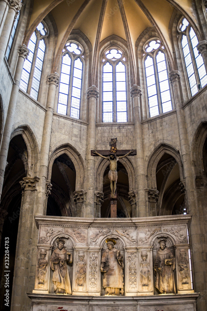 The apse with arches in Gothic style of the San Lorenzo Maggiore cathedral inside the old historic center of the city.