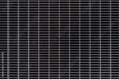 full frame image of grey metal cage background