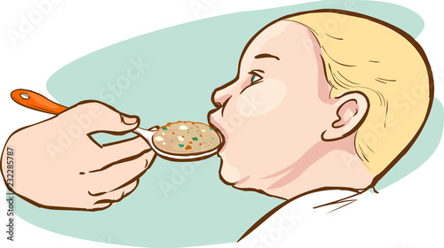 Baby being fed with a spoon
