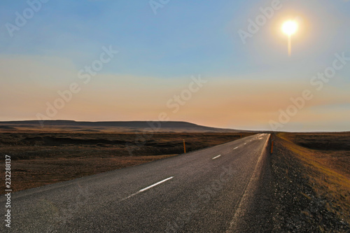 A long highway road with a view up to the horizon in a desert  Iceland