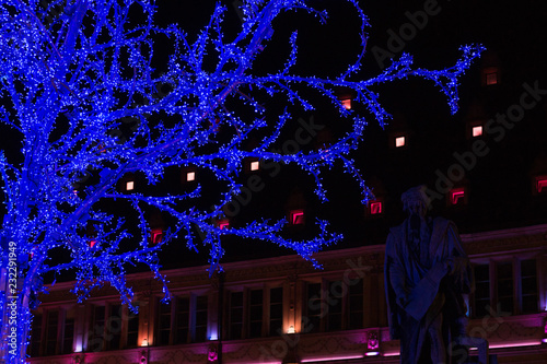 Illuminated blue tree at Place Gutenberg during Christmas season in Strasbourg, France