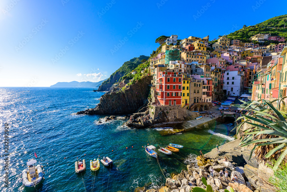 Riomaggiore - Village of Cinque Terre National Park at Coast of Italy. Beautiful colors at sunset. Province of La Spezia, Liguria, in the north of Italy - Travel destination and attractions in Europe.