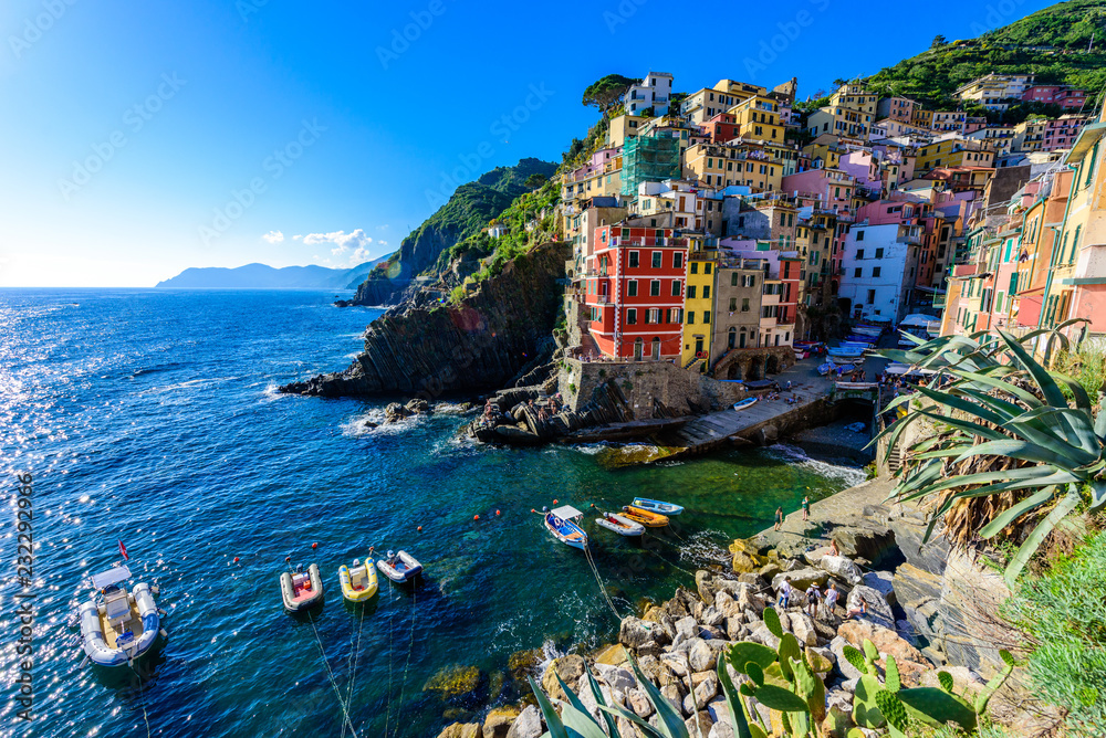 Riomaggiore - Village of Cinque Terre National Park at Coast of Italy. Beautiful colors at sunset. Province of La Spezia, Liguria, in the north of Italy - Travel destination and attractions in Europe.