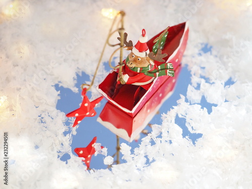 Wallpaper Mural Cute deer Santa Claus catching the star. Funny Christmas background Torontodigital.ca