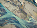 Aerial view of icy river showing veins