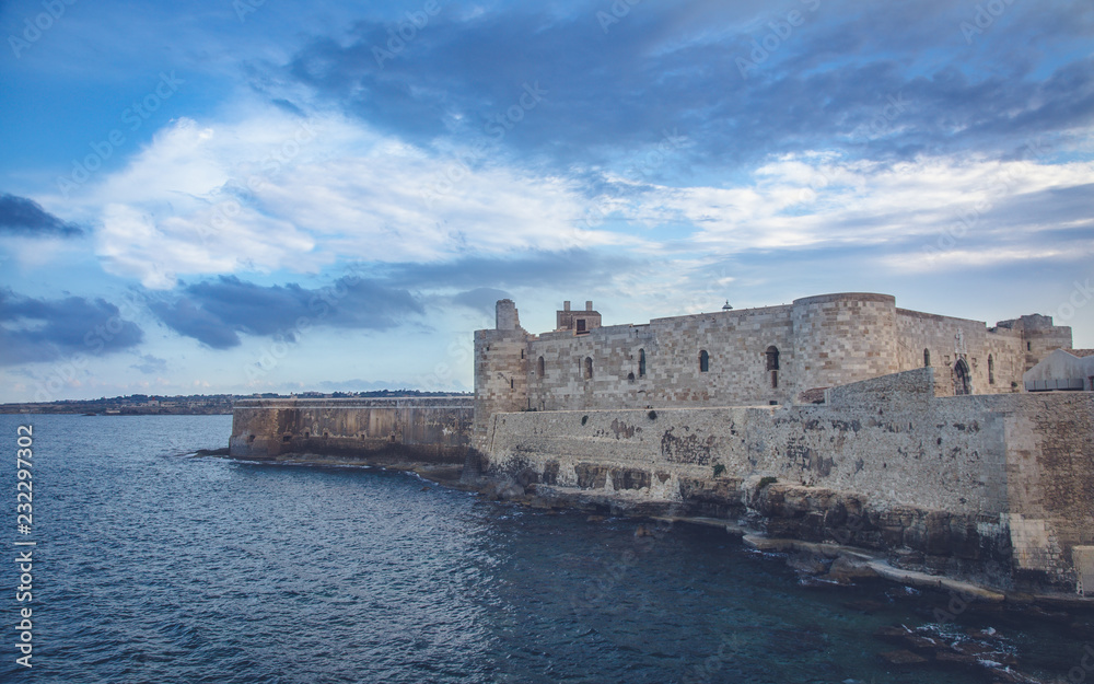 Wonderful evening view of famous Castello Maniace in Siracusa, Italy