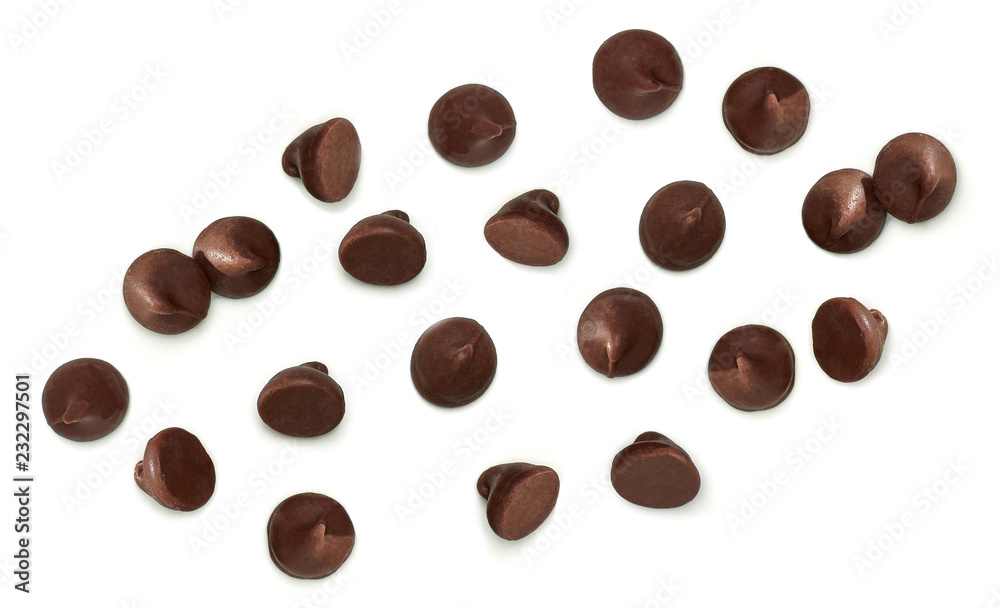 Scattered chocolate chips morsels or drops from top view isolated on white background Scattered chocolate chips morsels or drops from top view isolated on white background